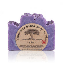 Load image into Gallery viewer, One sniff of this bar and I'm transported back to my childhood and the lilac tree growing outside our kitchen window. This true lilac scent is a favourite among flower lovers. Handmade, natural, vegan, olive oil soap. Made on Vancouver Island in BC, Canada.